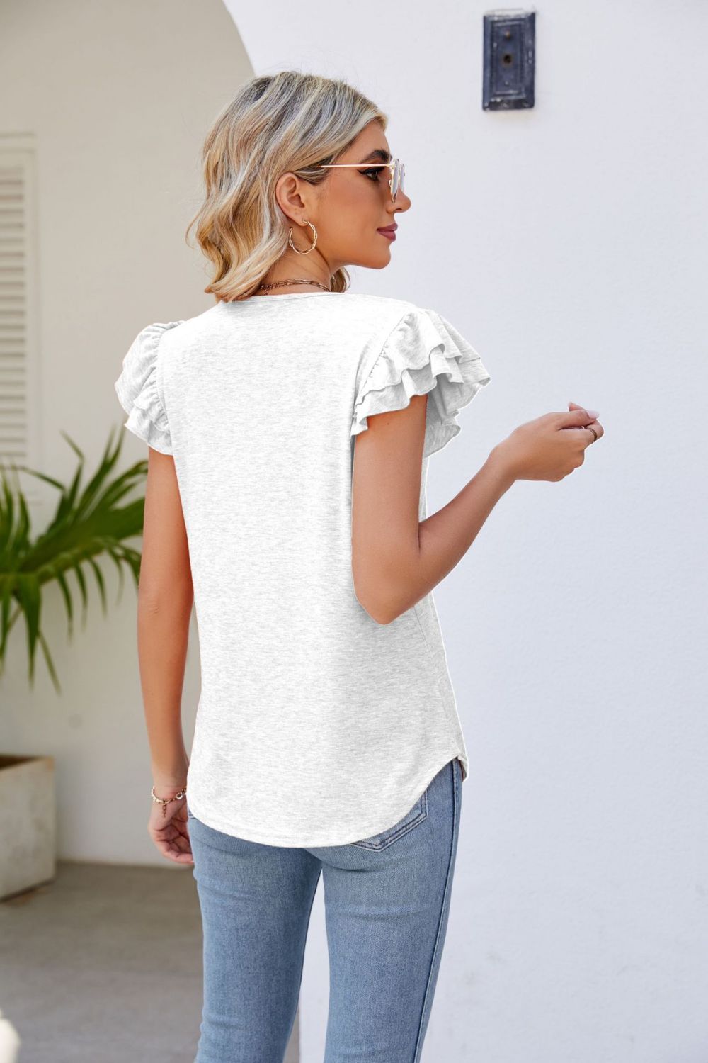 smocked flutter sleeve v-neck top