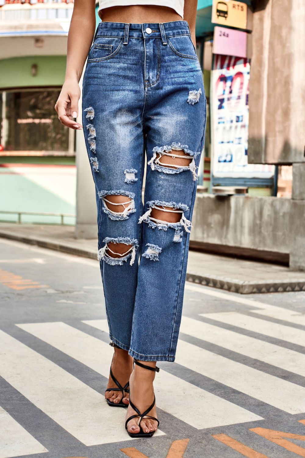 distressed buttoned jeans with pockets