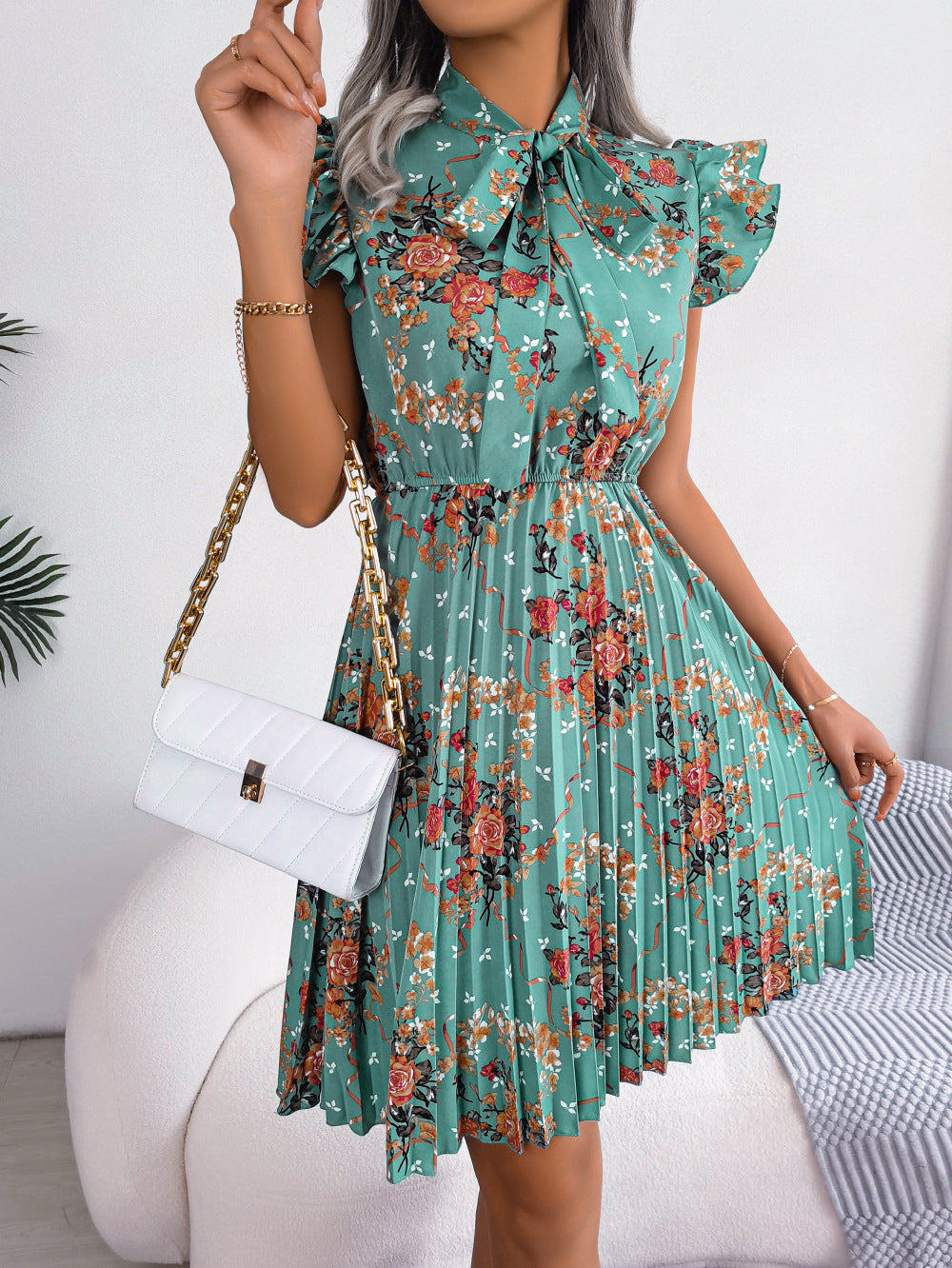 pleated floral printed tie neck knee length dress