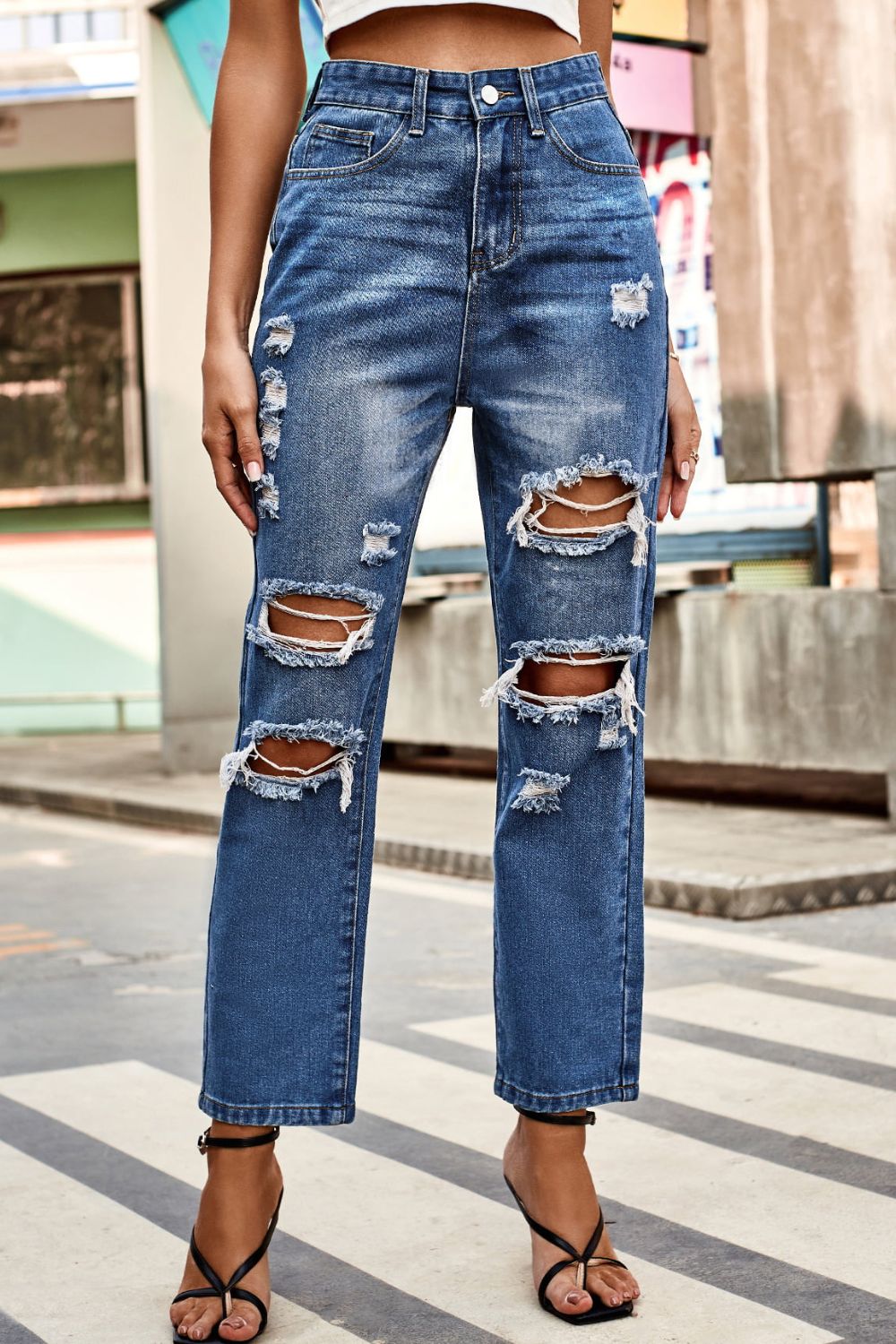 distressed buttoned jeans with pockets