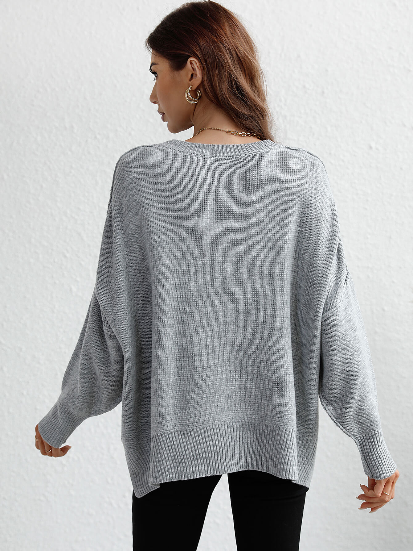 exposed seam dropped shoulder slit sweater