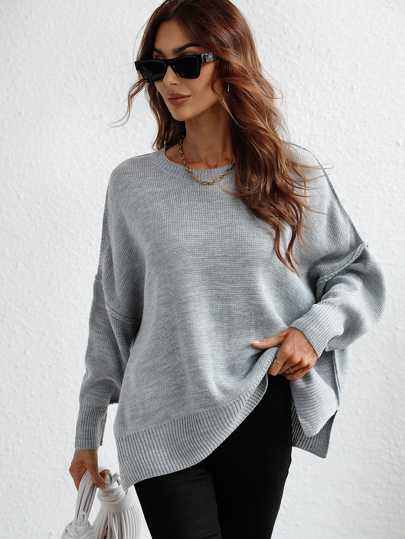 exposed seam dropped shoulder slit sweater