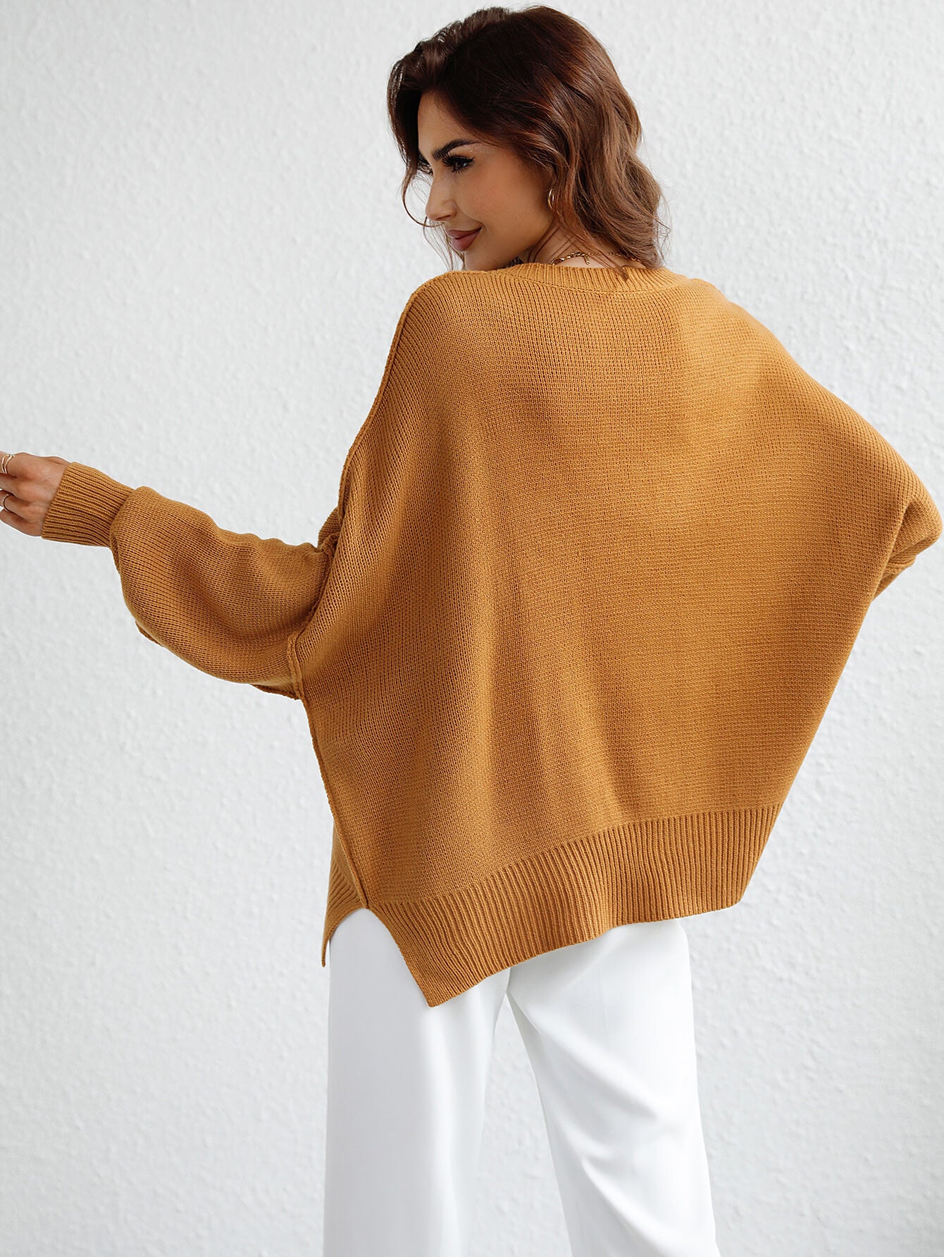 exposed seam dropped shoulder slit sweater