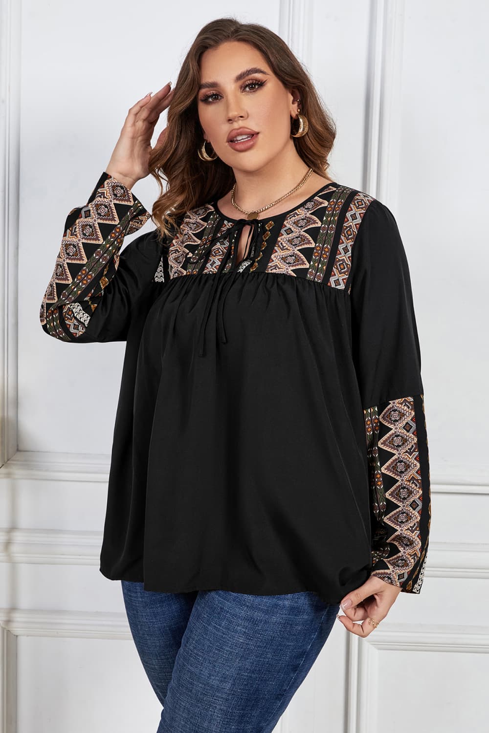 melo apparel plus size printed round neck tie front blouse