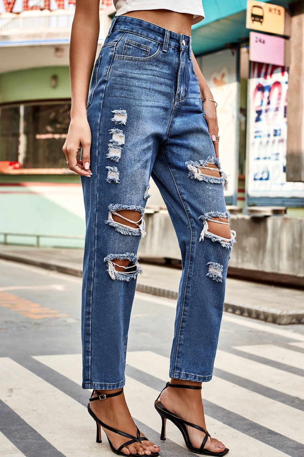 distressed buttoned jeans with pockets