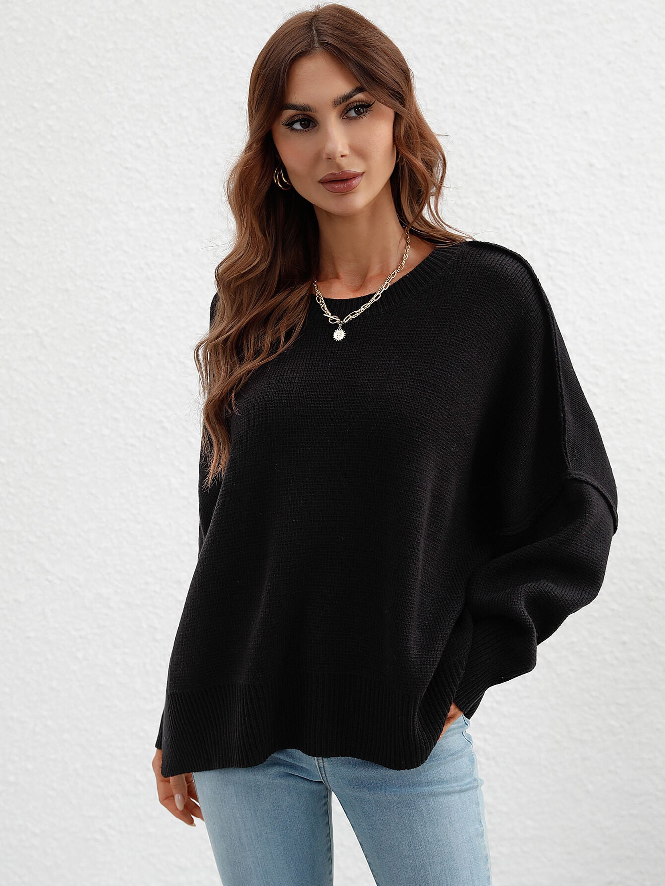 exposed seam dropped shoulder slit sweater