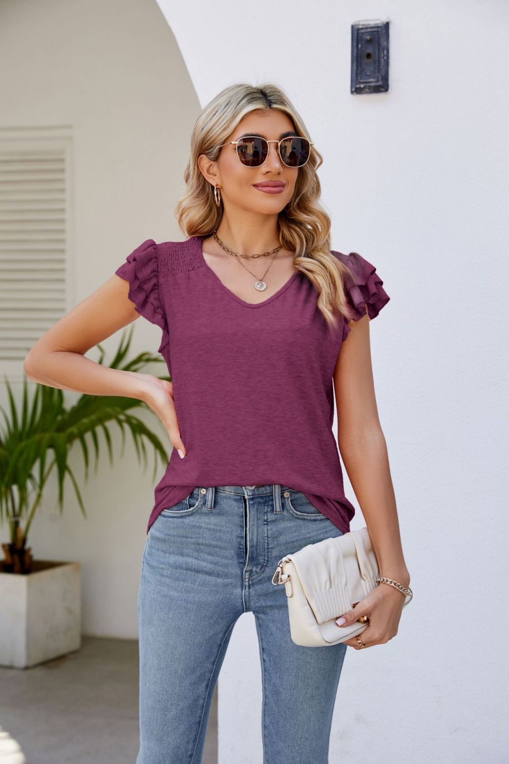 smocked flutter sleeve v-neck top