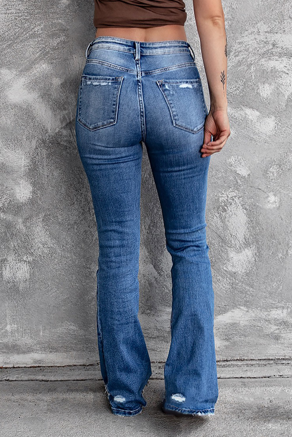 distressed flared jeans with pockets