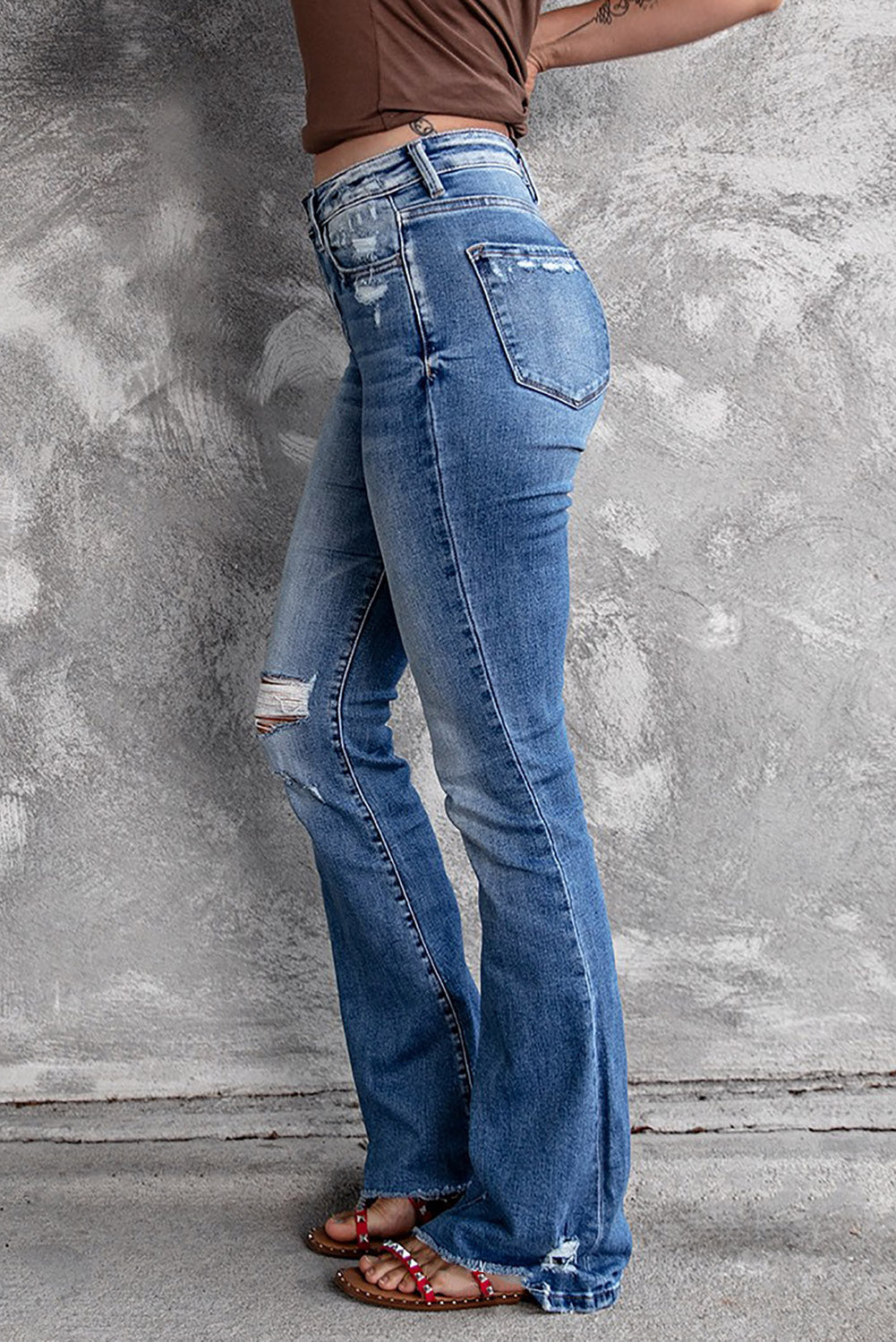 distressed flared jeans with pockets