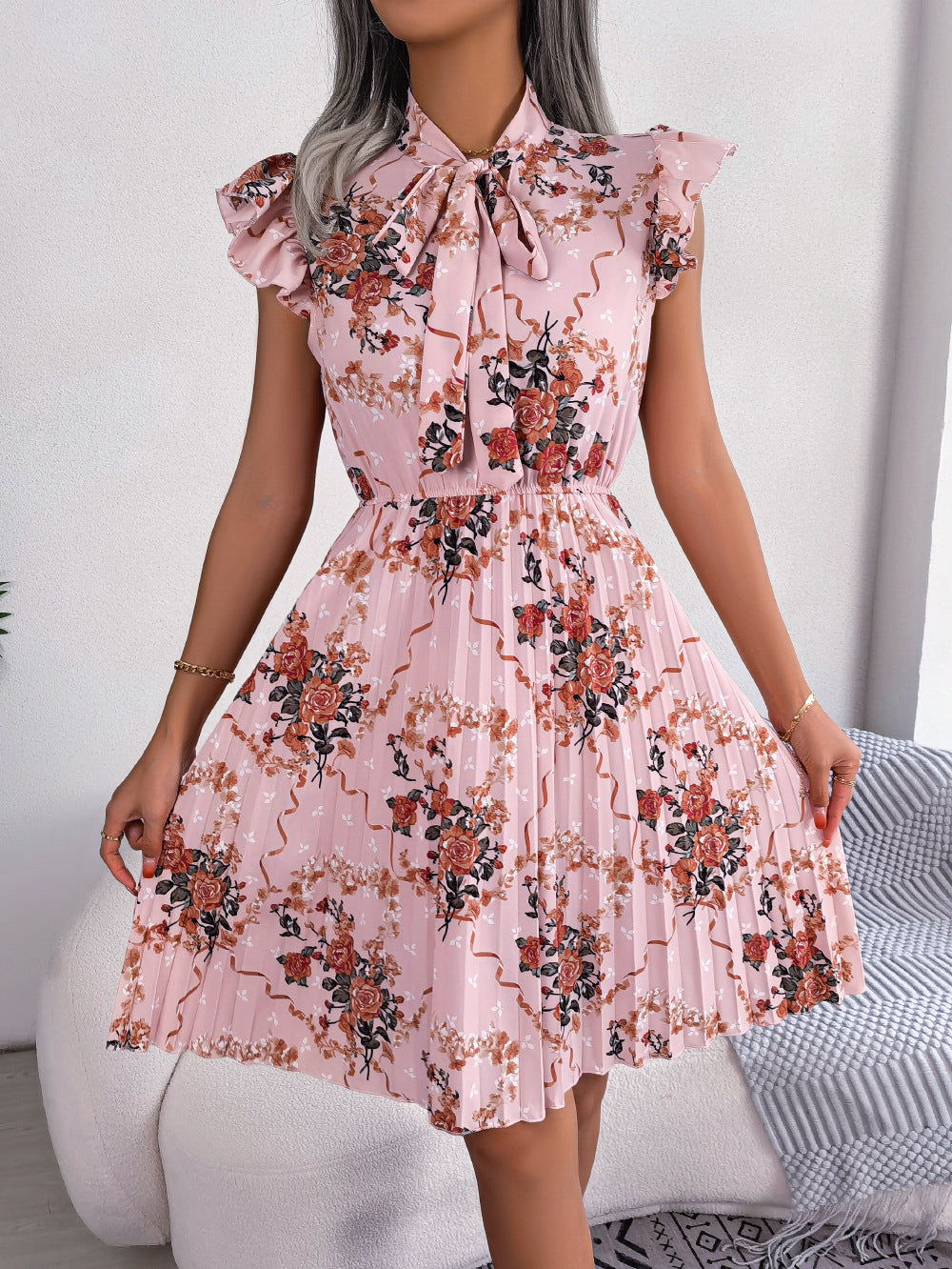 pleated floral printed tie neck knee length dress