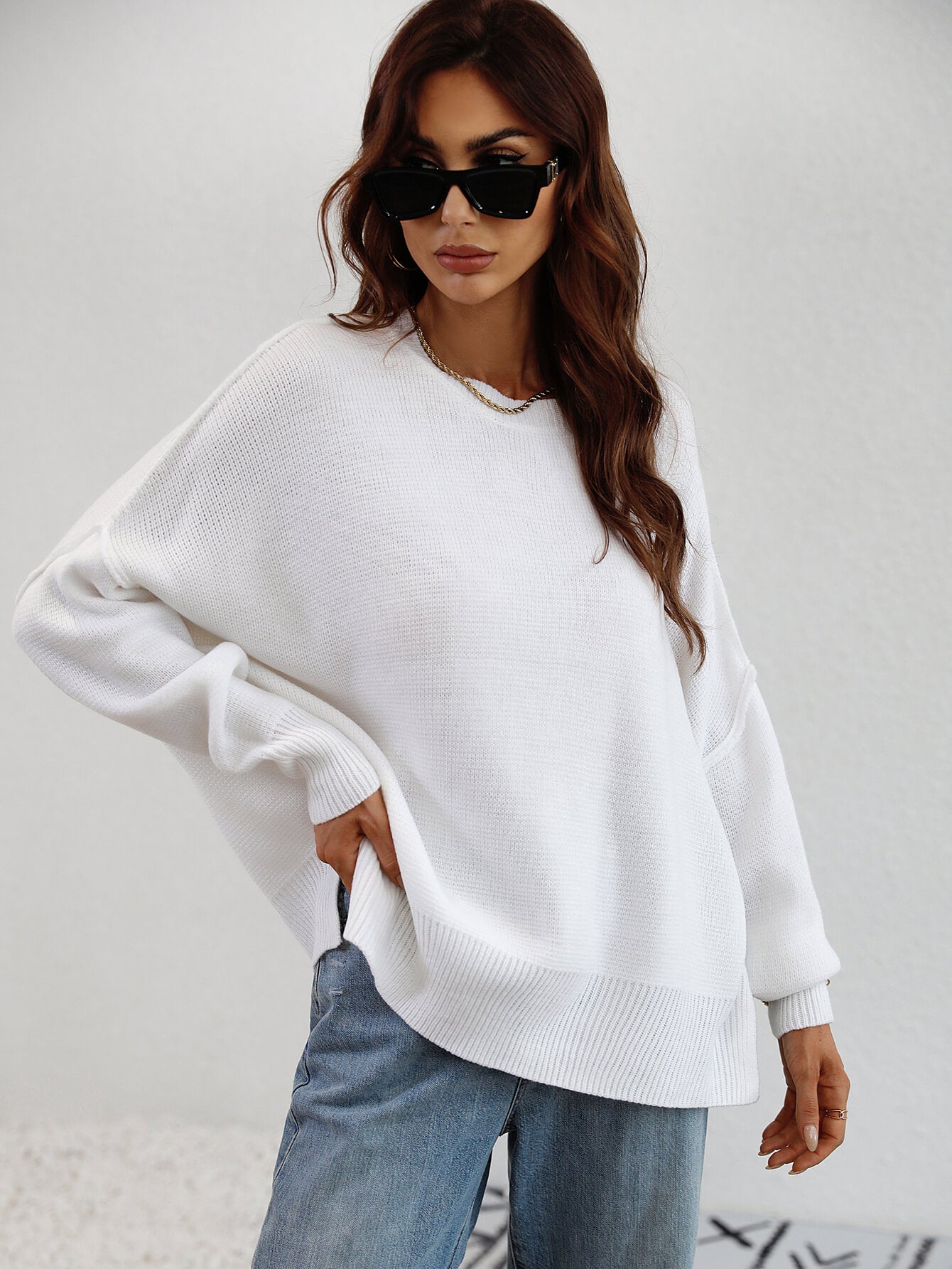 exposed seam dropped shoulder slit sweater