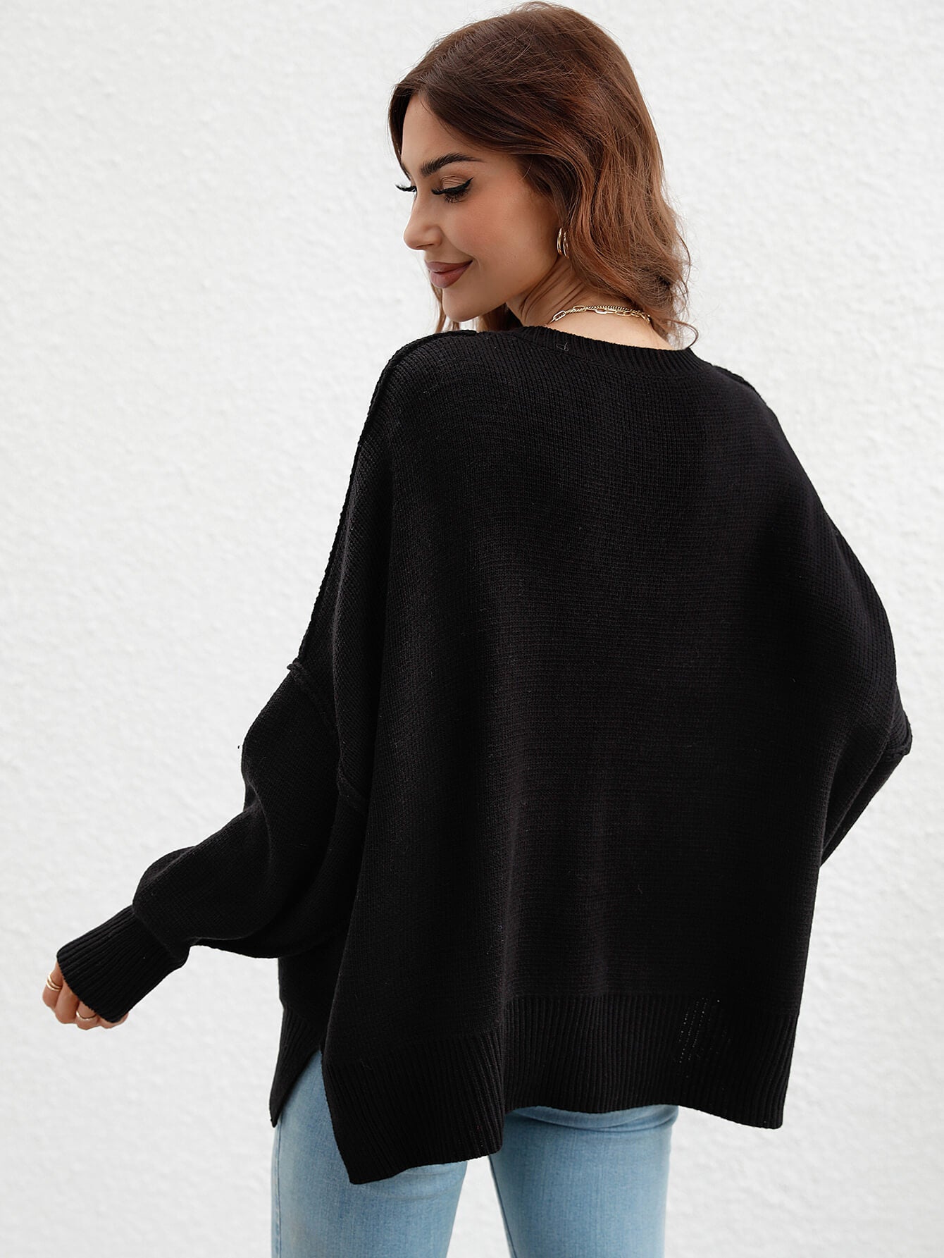 exposed seam dropped shoulder slit sweater