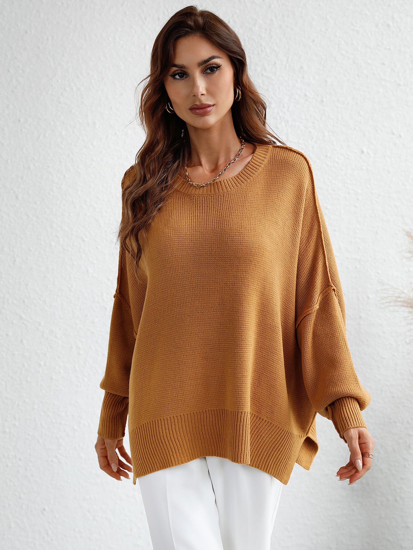 exposed seam dropped shoulder slit sweater